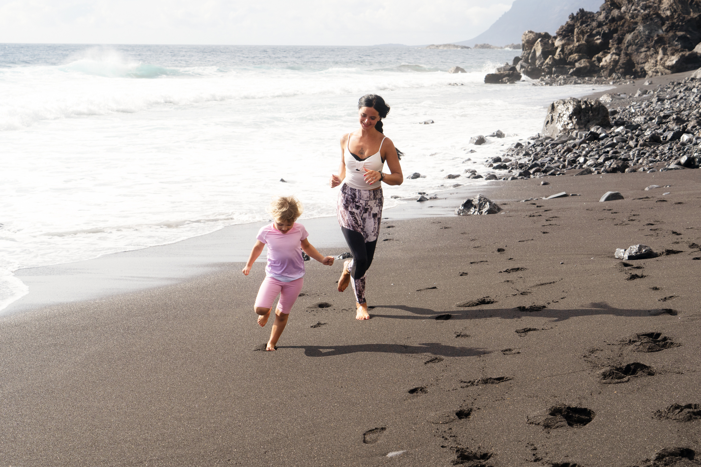 Healthy Happy Family Mom and Daughter Doing Stretching Exercises on Seaside